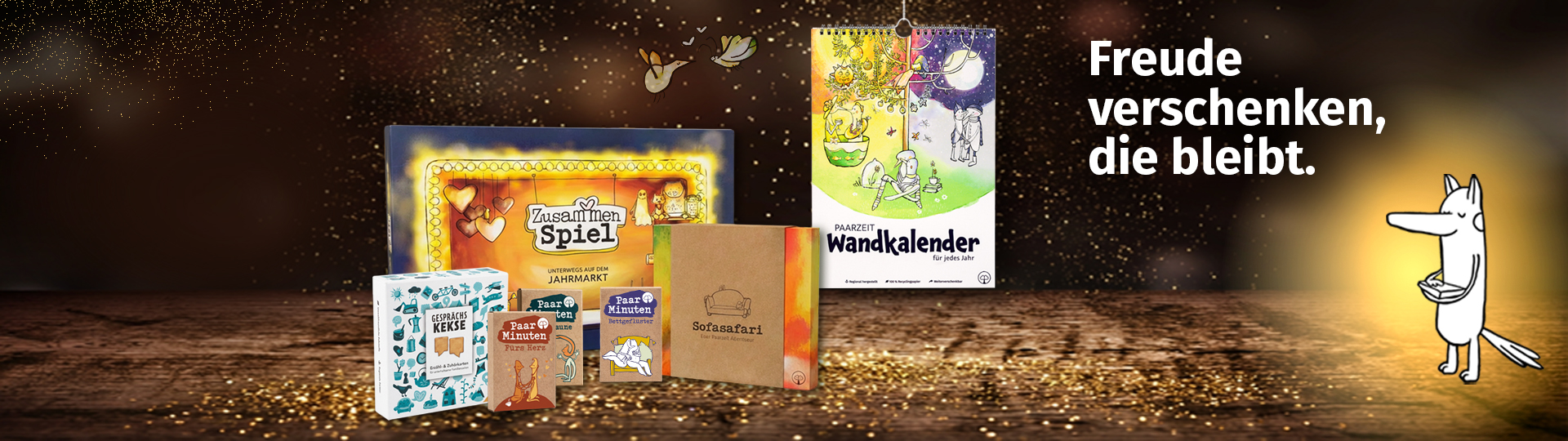 Großes Headerbild der Paarzeit-Produktübersicht mit Spielen, Paarzeit-Wandkalender und der Botschaft Freude verschenken, die bleibt